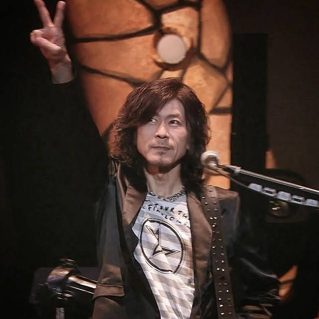 Hidehiko Hoshino doing a peace sign